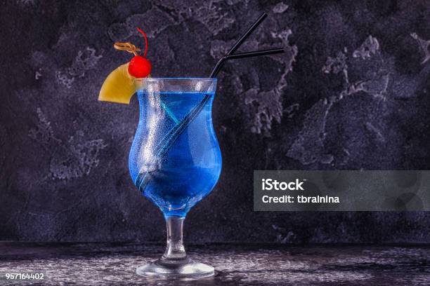 Blue Curacao Cocktail Decorated With Fruit Stock Photo - Download Image Now - Alcohol - Drink, Bar - Drink Establishment, Beach