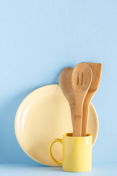 istock Crockery and cutlery on a blue pastel background 957165002