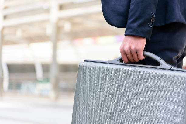 istock The asian businessman has holding a black bag. 957167366