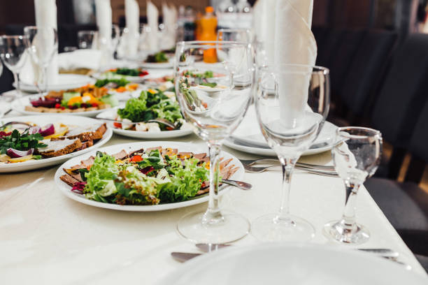 istock catering table set service with silverware and glass stemware at restaurant before party 957168256
