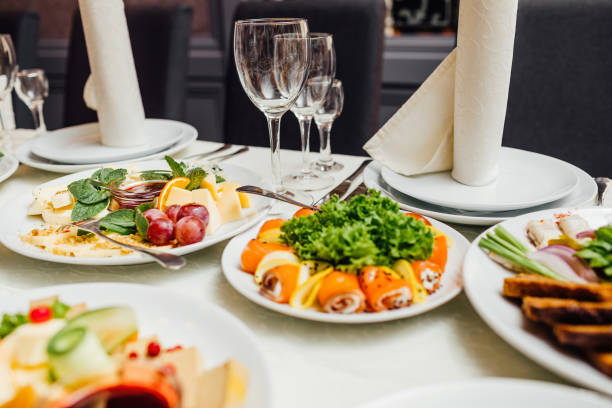 istock catering table set service with silverware and glass stemware at restaurant before party 957168260