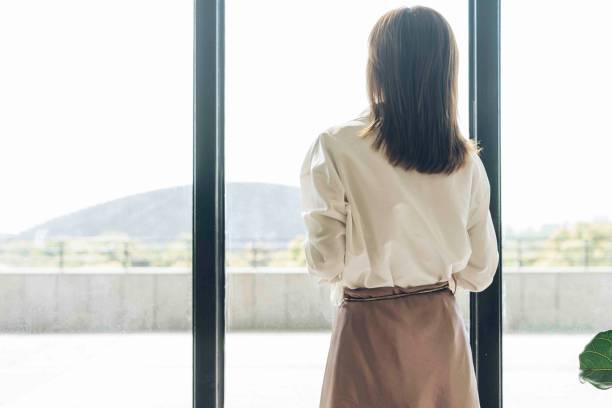 istock attractive woman enjoying weekend leisure time alone at home 957169942
