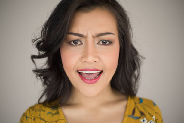 istock woman angry on white background 957170278