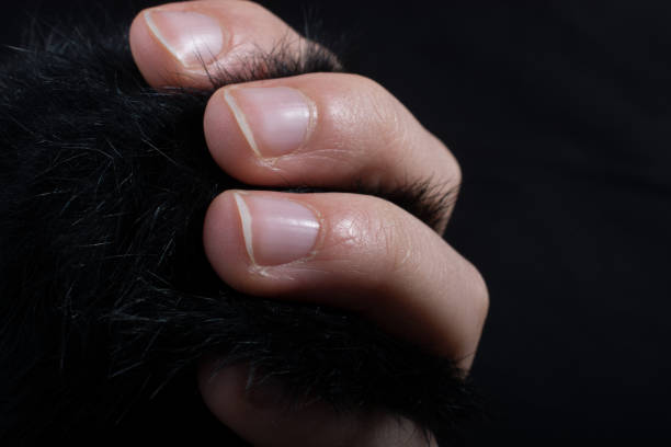 istock Three  fingers of a human hand partly seen in view 957173616