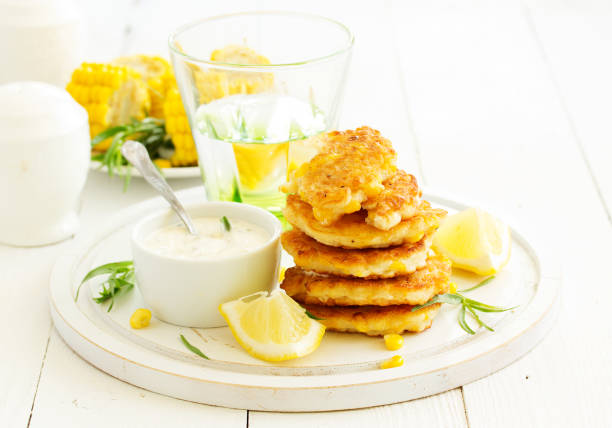 istock Corn pancakes with cream sauce with tarragon. 957173960