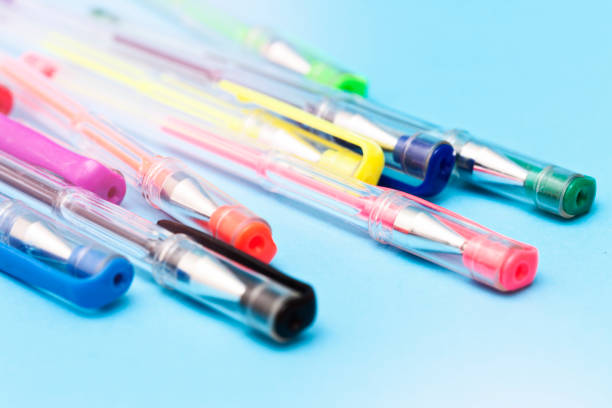 istock Bunch of multicolored ballpoint pens, brightly lit 957178760