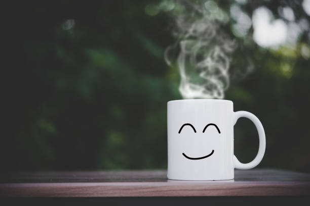 istock happy cups on wood table  with bokeh 957178834