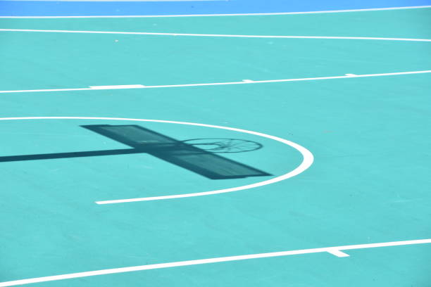 istock Shadow of basketball hoop 957181786