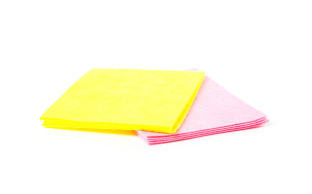 istock Yellow and pink rags. Close up. Isolated on white background 957182120