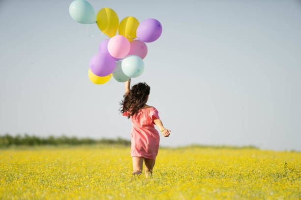 istock Woman running across a meadow 957184066