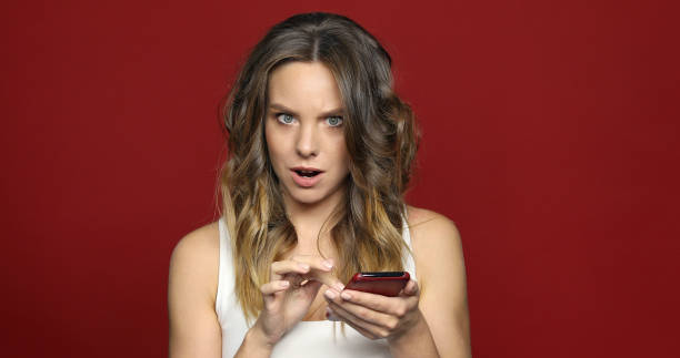 istock Woman using smartphone strange news 957192876