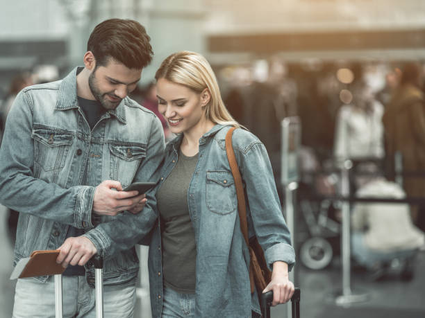 istock Cheerful man and glad female watching at mobile 957194548