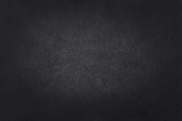 istock Dark grey black slate texture in natural pattern with high resolution for background and design art work. Black stone wall. 957195156