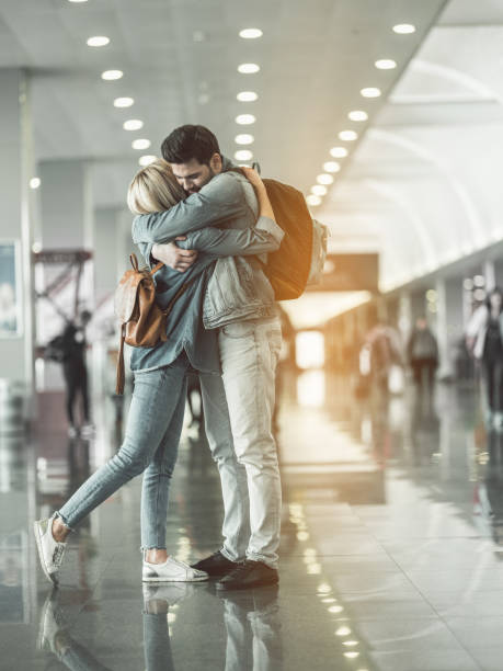 istock Outgoing man hugging cheerful female 957195630