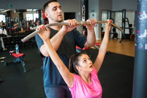istock Young people exercising at gym 957202856