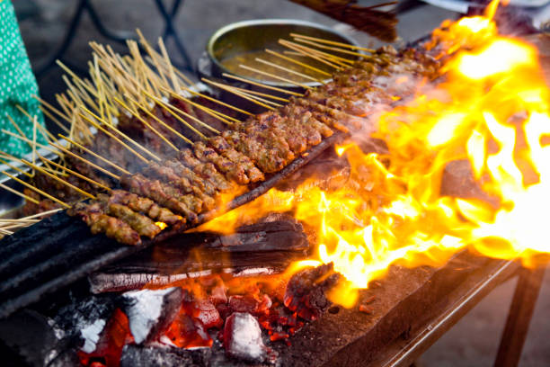 Satay is a marinated skewered chicken and meat which is a popular street food dish in Malaysia.  It is usually grilled on a makeshift or mobile stall by the road side. There are other versions of satay around the Southeast Asia region with various type of meat.