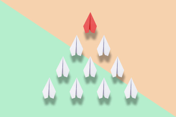 istock red paper plane leading white ones, leadership concept 957207346