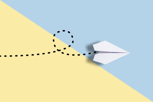 istock being different concept with red paper plane going in a different directio 957207354