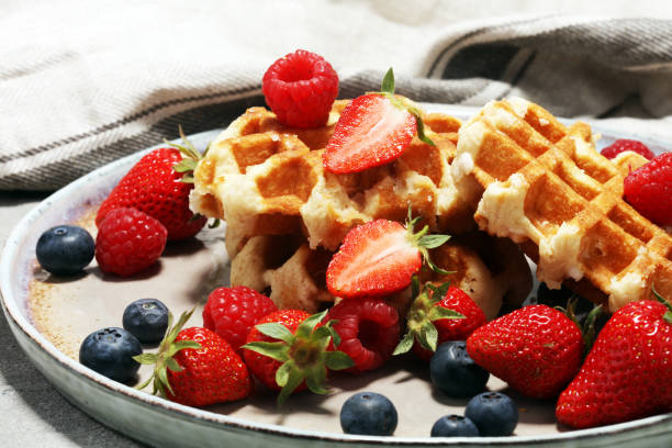istock Traditional belgian waffles with fresh fruit 957208396