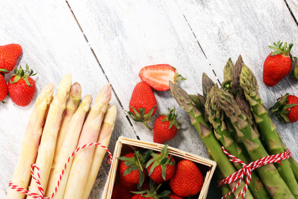 istock White and green asparagus with strawberries 957208606