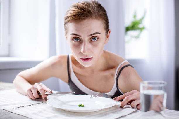 istock Pale young woman looking at you 957217710