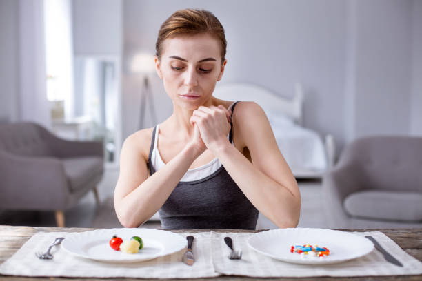 istock Sad hungry woman making a choice 957222038