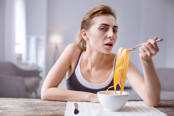 istock Cheerless young woman looking at you 957222826