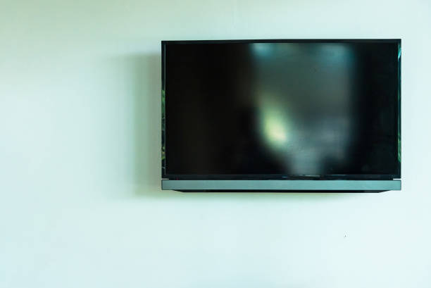 istock Led tv hanging on the white wall background. 957223390