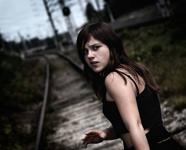 Young girl on the railway stock photo