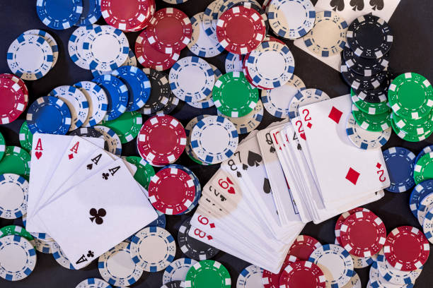 istock playing cards and casino poker chips on green 957230148