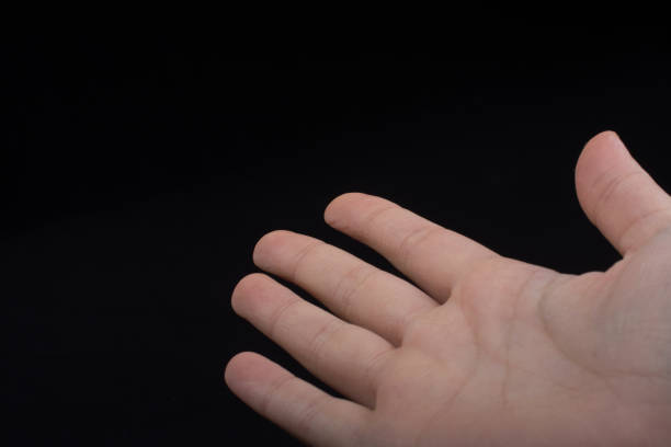 istock Five  fingers of a human hand partly seen in view 957235400