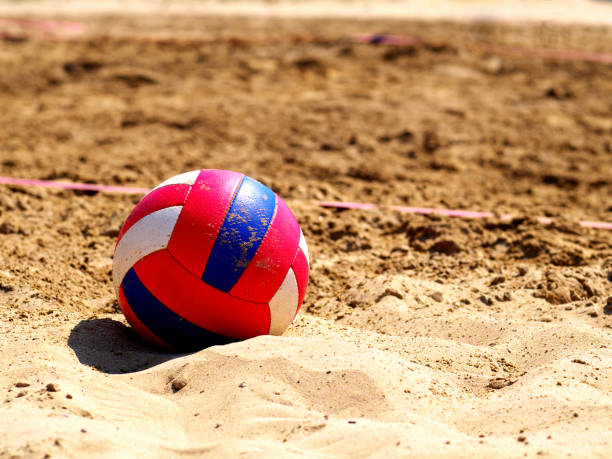 istock Beach volleyball game ball on sand 957239344