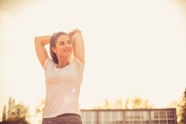 istock Stretching after workout. Woman exercising. 957240114