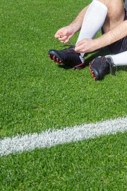 istock Soccer player tying his shoe 957241026