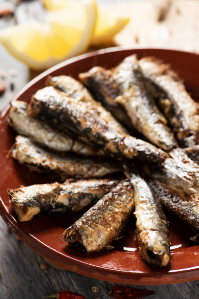 istock spanish grilled sardines in a plate 957243430