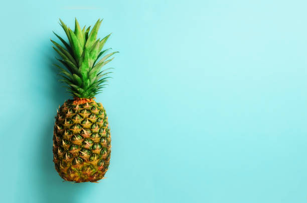 istock Pineapple on blue background. Top View. Copy Space. Pattern for minimal style. Pop art design, creative concept 957245050