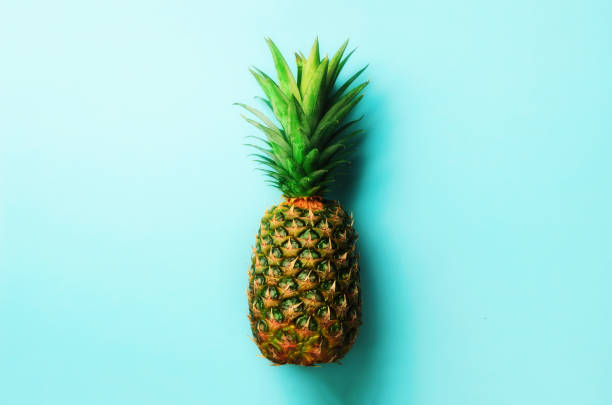 istock Pineapple on blue background. Top View. Copy Space. Pattern for minimal style. Pop art design, creative concept 957245184