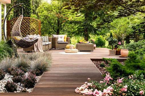 Wooden terrace surrounded by greenery