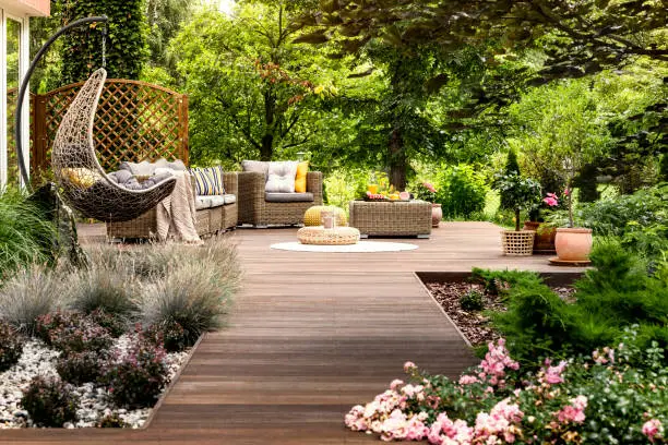 Photo of Wooden terrace surrounded by greenery
