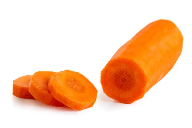 Peeled carrot with round slices isolated on white.