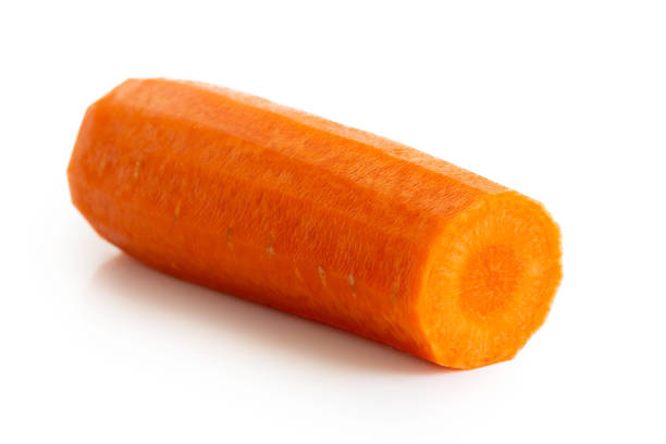 istock Cut and peeled carrot isolated on white. 957252270