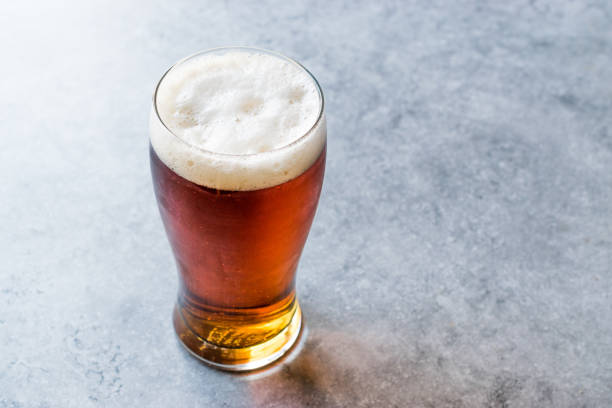 istock Cool Refreshing Red Amber Beer in Glass 957255086
