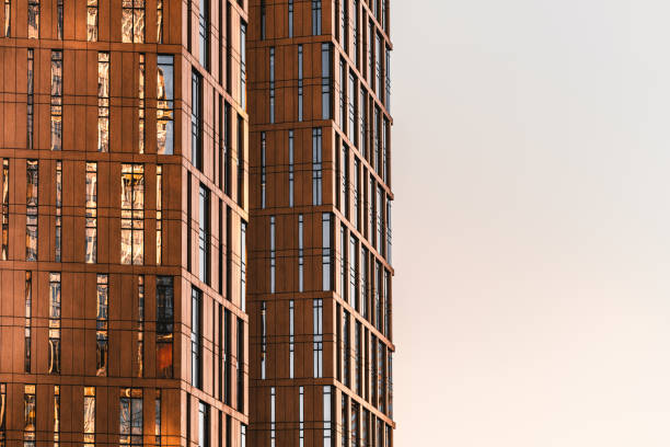 istock Fragment of contemporary high-rise facade with sky 957255796