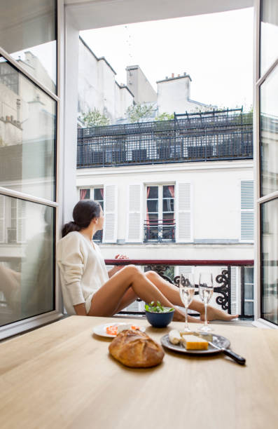 istock Woman having breakfast in hotel in Paris 957260774