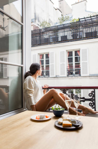 istock Woman having breakfast in hotel in Paris 957260780