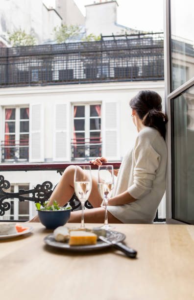 istock Woman having breakfast in hotel in Paris 957260808