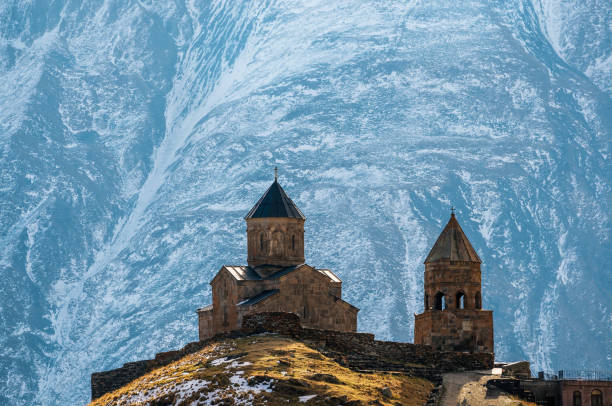 istock Caucasus mountains, Gergeti Trinity church, Georgia 957262522