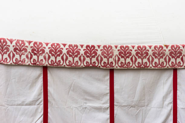 Detail of a medieval tent made of canvas and decorated with an ornament of red color