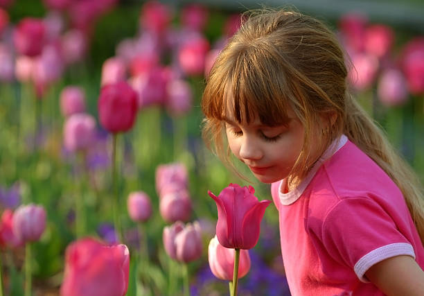 istock Girl Smelling Flowers 95727361