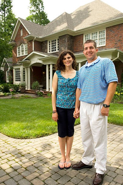 istock Married couple in front of home 95727383